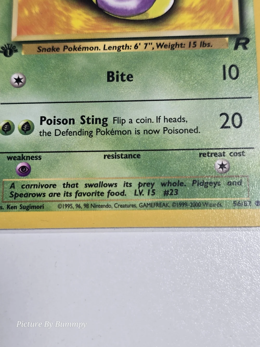 #16 Pokemon 1st Edition Ekans card from the Team Rocket set, numbered 56/82.